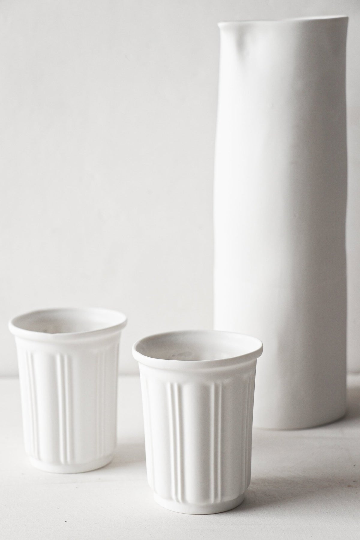 Ensemble Carafe et timbales en porcelaine
